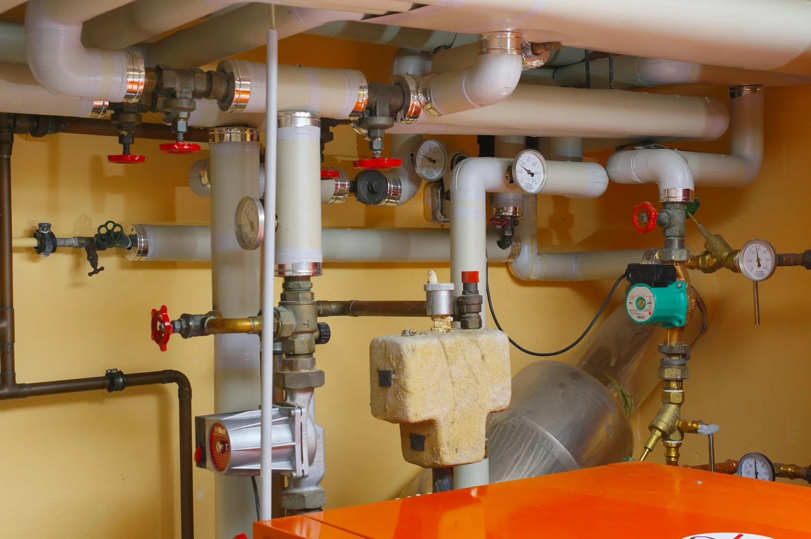 Water supply pipes and shut off valves in a utility space